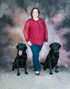 Lynn Stacy-Smith professional photo standing with Labrador retrievers Jackson and Tinkerbell